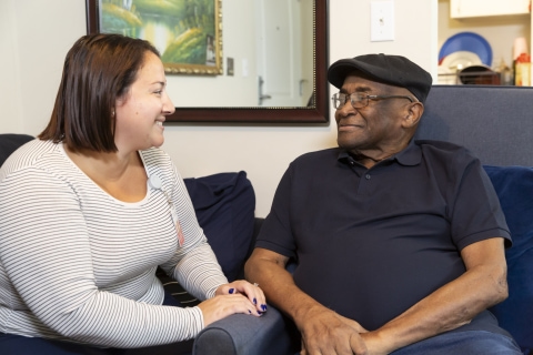 Good Shepherd care worker with patient